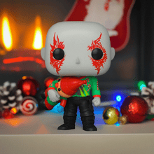Load image into Gallery viewer, Holiday-themed Drax Pop! Vinyl figure holding a present with festive decor.