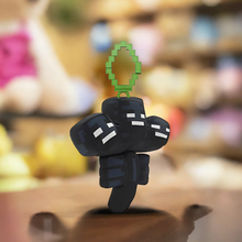Load image into Gallery viewer, Minecraft 5 Inch Wither Bag Hanger Plush with pixelated design and clip, displayed on a table.
