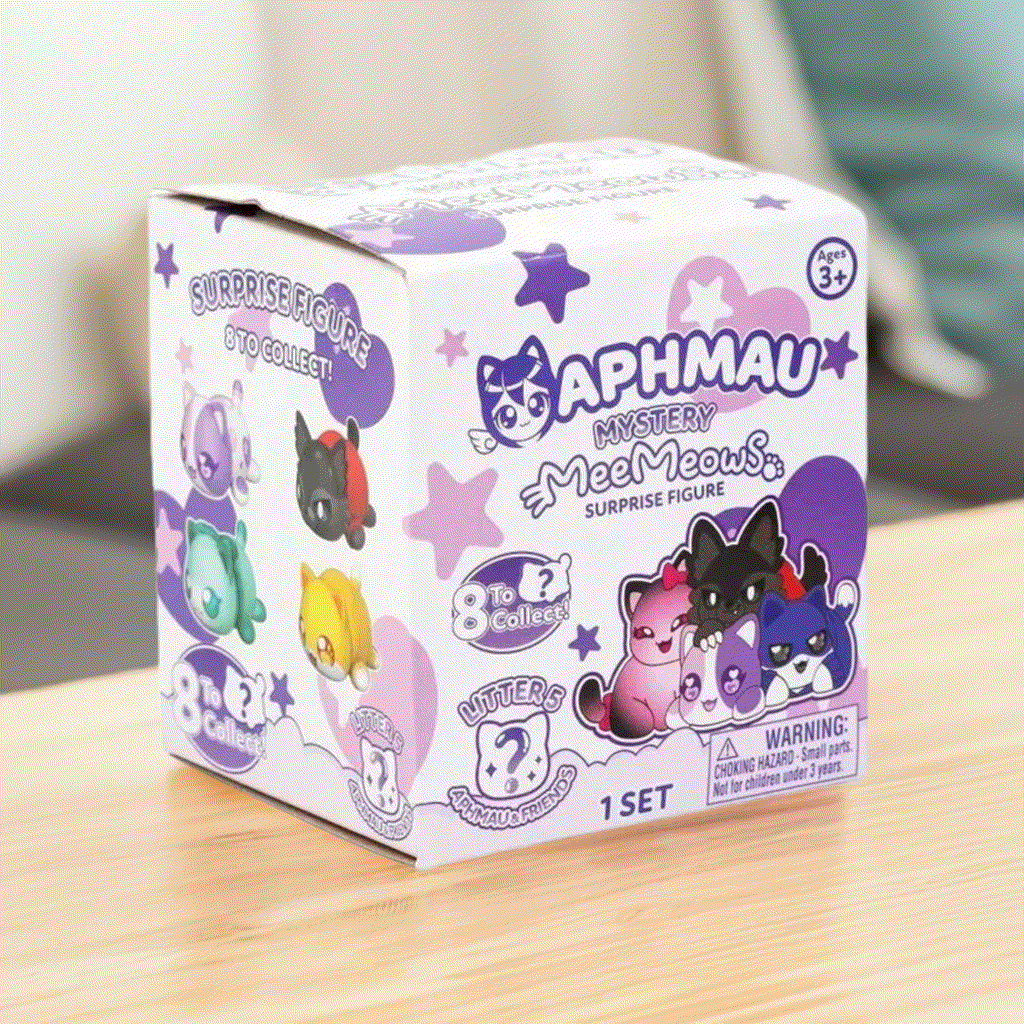Aphmau Mystery MeeMeows Surprise Figure Litter 5 box with cute cat illustrations on a wooden surface.
