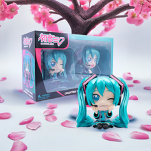 Load image into Gallery viewer, Hatsune Miku Collectible Twin Figure Pack featuring two playful figures with vibrant colors and intricate details.