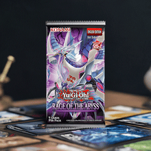 Load image into Gallery viewer, Yu-Gi-Oh! Rage of the Abyss Booster Pack featuring dark and water-themed cards on a table setting.