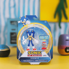 Load image into Gallery viewer, Hedgehog Sonic figure with collectible ring container in packaging.