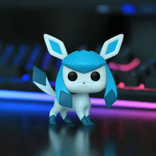 Load image into Gallery viewer, Glaceon Pokemon POP! Vinyl figure with icy blue design, showcasing intricate patterns and expressive eyes on a dark background.