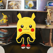 Load image into Gallery viewer, Pokemon Laplander Pikachu Beanie with Pikachu face, rosy cheeks, pointy ears, and Poké Ball tassels.