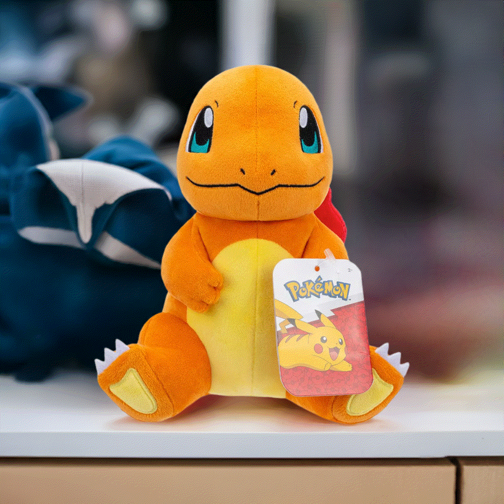 Pokemon 8 Inch Plush - Charmander Sitting on display with tag, soft and huggable toy for collectors and fans.