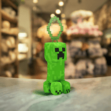 Load image into Gallery viewer, Minecraft 5 Inch Creeper bag hanger plush with pixelated detailing, soft and huggable design, equipped with a clip.
