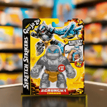 Load image into Gallery viewer, Goo Jit Zu Stretch Strikers Thrash figurine in packaging, showcasing stretchable shark character with illustrated action features.
