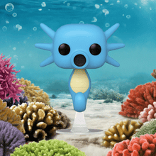 Load image into Gallery viewer, Horsea Pokemon POP! Vinyl Figure displayed underwater among colorful corals.