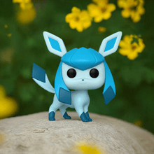 Load image into Gallery viewer, Glaceon Pokemon POP! Vinyl figure with icy blue design on a natural background.