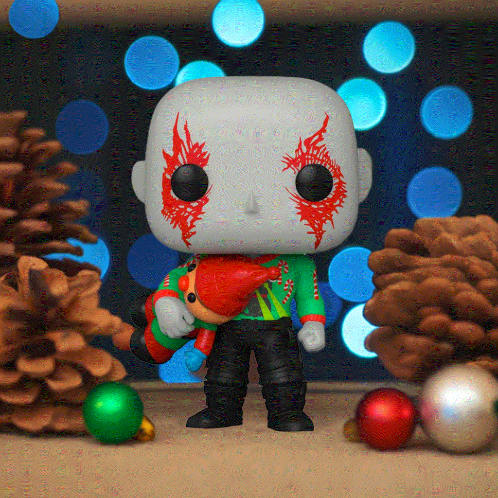 Holiday-themed Drax Pop! Vinyl Figure with festive sweater and present, surrounded by pinecones and ornaments.