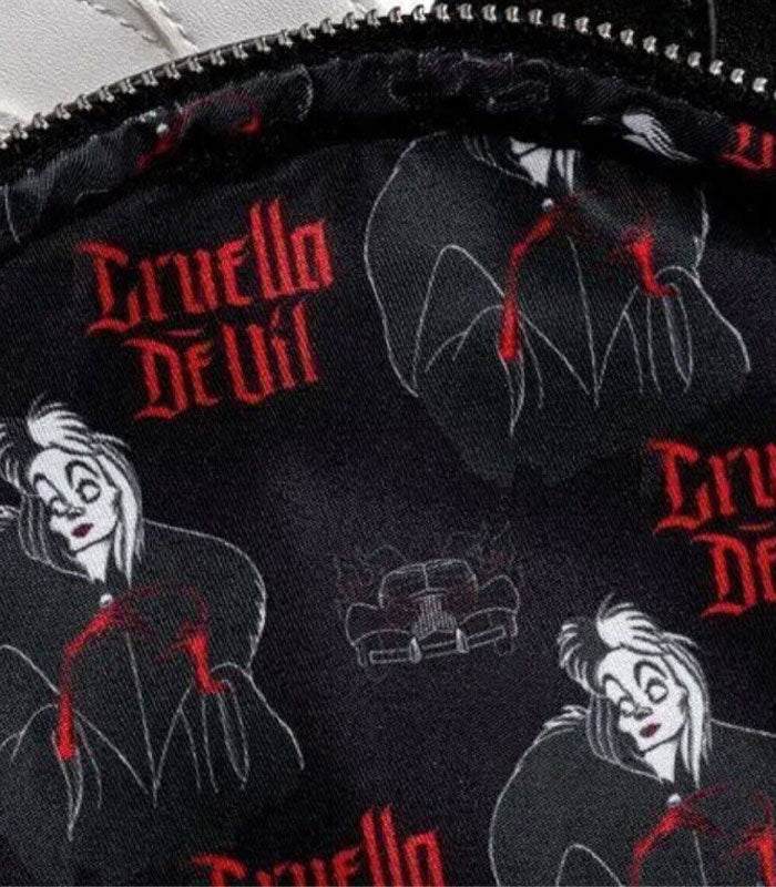 Loungefly Disney Villains Cruella De Vil mini backpack with polka dots and Cruella's smirk design.
