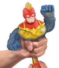 Load image into Gallery viewer, Goo Jit Zu Captain Marvel toy being stretched and squeezed in hand.