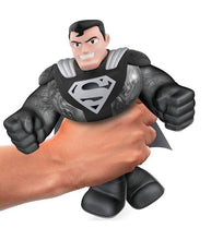 Load image into Gallery viewer, Heroes of Goo Jit Zu Kryptonian Armor Superman toy being squeezed.