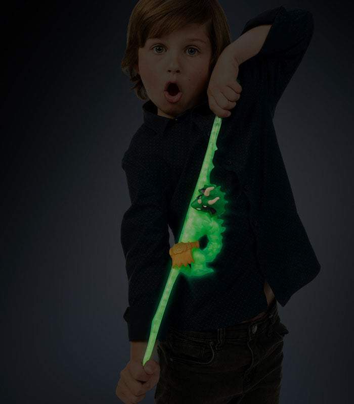 Goo Jit Zu Glow Shifters Tritops toy glowing and being stretched by a child.