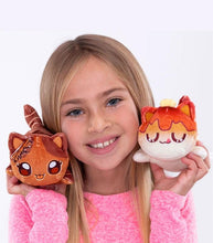 Load image into Gallery viewer, Aphmau Mystery MeeMeows Surprise Plush held by smiling girl wearing pink sweater.