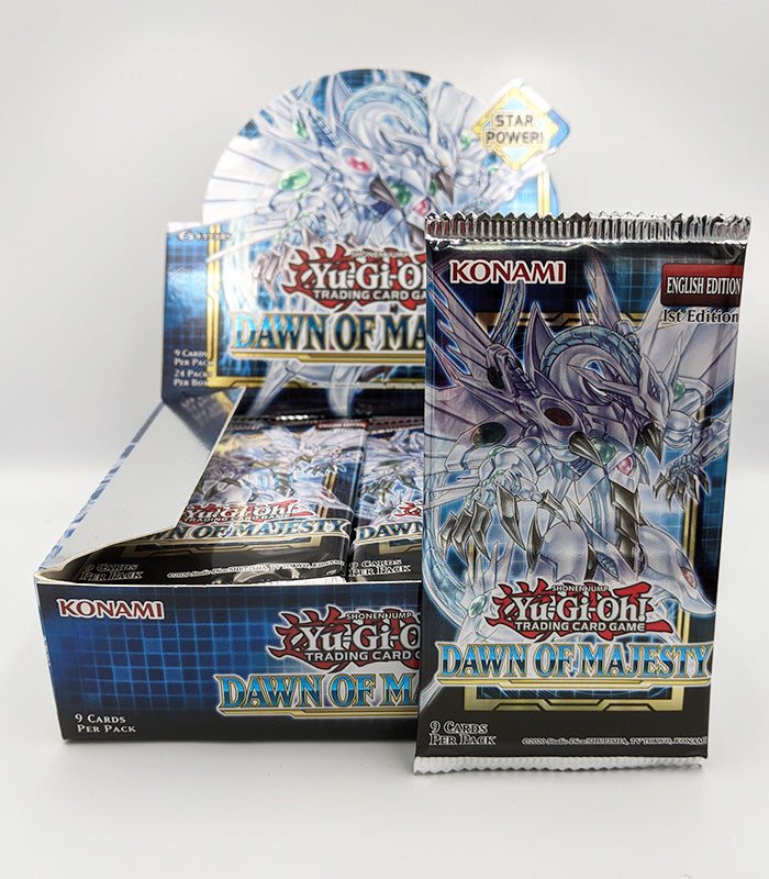 Yu-Gi-Oh! Dawn Of Majesty Booster Pack with cards on display.
