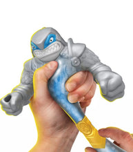 Load image into Gallery viewer, Hero of Goo Jit Zu Stretch Strikers - Thrash being squeezed and stretched, showcasing its gooey filling.
