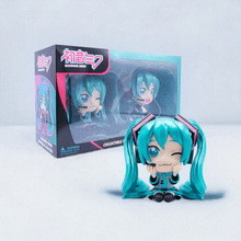 Load image into Gallery viewer, Hatsune Miku Collectible Twin Figure Pack showcasing two figures with signature twin-tail design, in front of a themed box.

