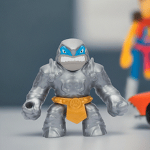 Load image into Gallery viewer, Goo Jit Zu Stretch Strikers Thrash toy figure on display.

