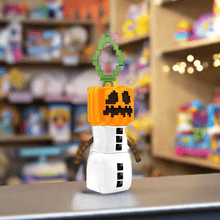 Load image into Gallery viewer, Minecraft 5 Inch Snow Golem Bag Hanger Plush with pixelated pumpkin head.
