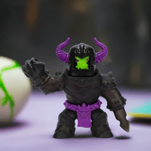 Load image into Gallery viewer, Goo Jit Zu Stretch Strikers - Ultra Rare Black Knight Orbitox toy figure with dark armor and purple accents.
