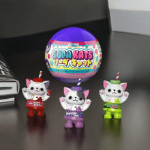 Load image into Gallery viewer, Paka Paka Soda Kats collectible figures with soda can designs displayed on a table.
