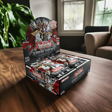 Load image into Gallery viewer, Yu-Gi-Oh Supreme Darkness Booster Box on a wooden table, showcasing vibrant card pack artwork.
