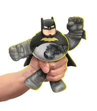Load image into Gallery viewer, Goo Jit Zu Goo Shifters DC Night Power Batman toy being stretched, showing unique goo filling.
