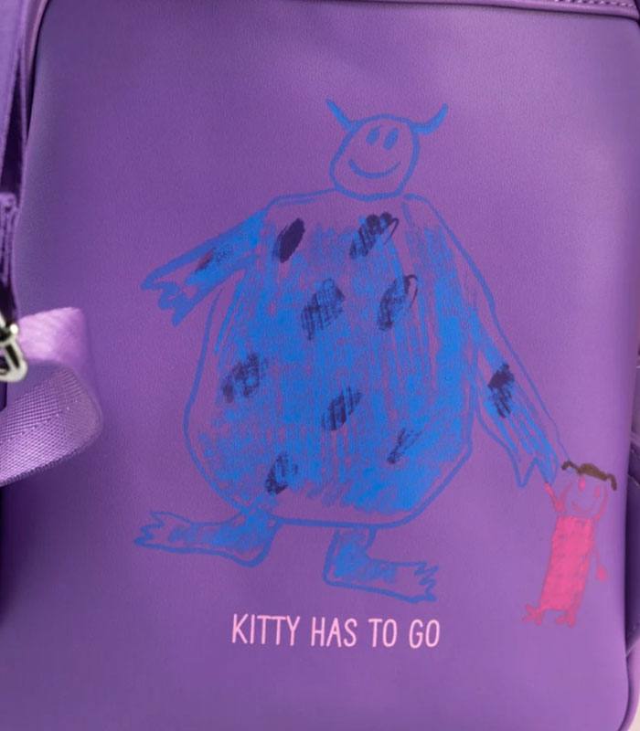 Loungefly Disney Pixar Monsters Inc mini backpack with Boo's drawing of Sully, crafted from vegan-friendly faux leather.