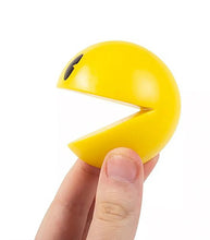 Load image into Gallery viewer, Pac-man Comic Ons wall-mountable figure in hand.
