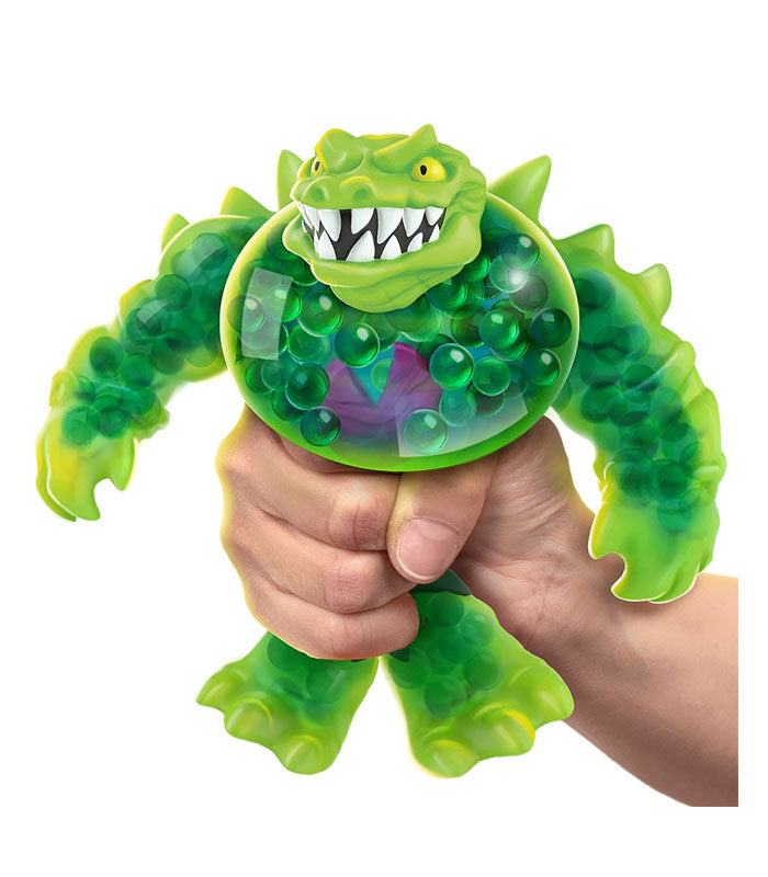 Heroes of Goo Jit Zu Goo Shifters - Rock Jaw toy being squeezed, showcasing its stretchable and shape-shifting abilities.
