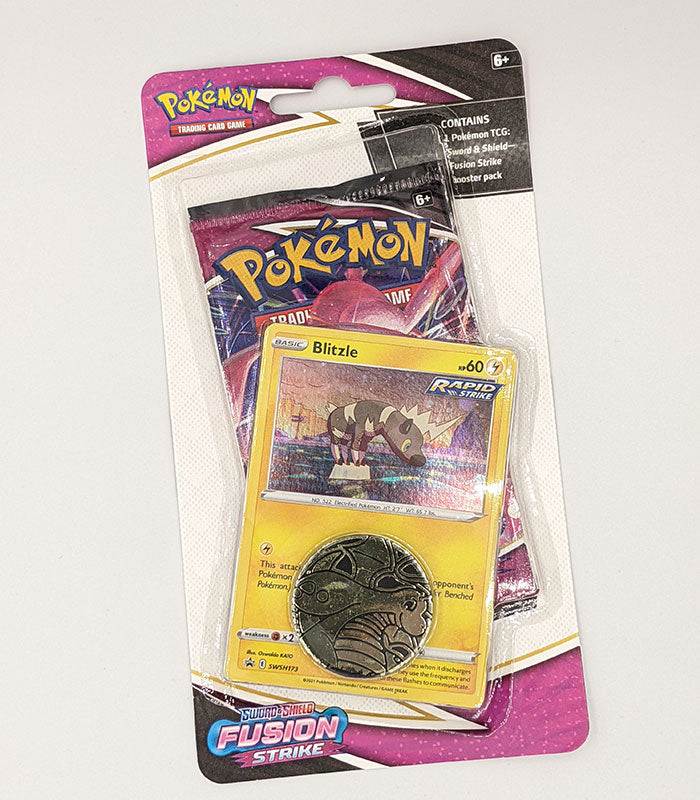 Pokémon TCG Sword & Shield Fusion Strike Blister Pack featuring Blitzle card and Dragonite coin.