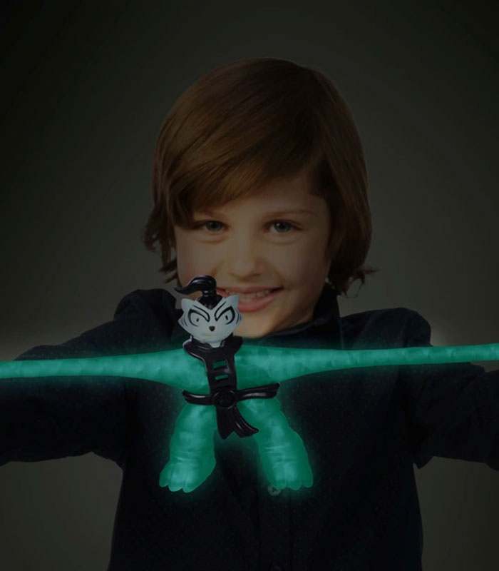 Goo Jit Zu Glow Shifters Bengal toy glowing in a child's hands.