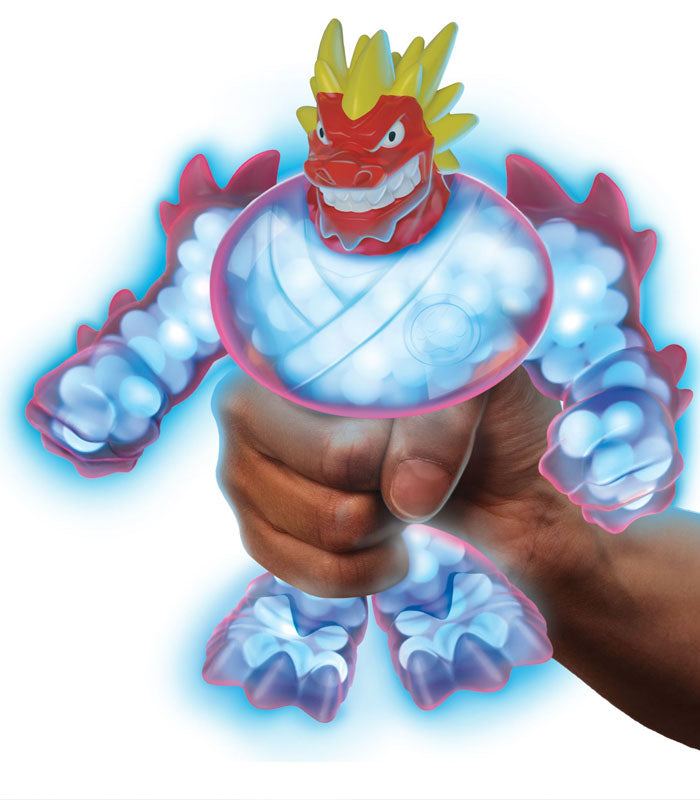 Goo Jit Zu Glow Shifters Blazagon toy being squished, showing its stretchy, gooey texture and glowing features.