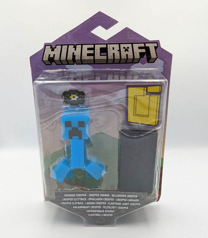 Minecraft Portal Action Figure - Charged Creeper with accessories and portal piece in packaging.