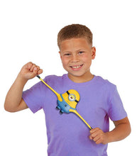 Load image into Gallery viewer, Child playing with Stretch Armstrong Minions Stuart toy.
