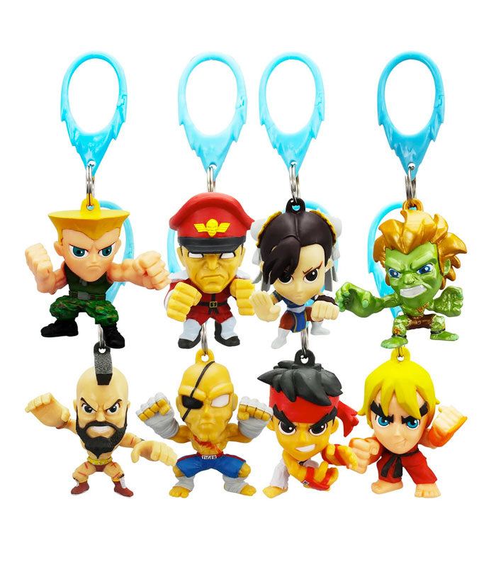 Street Fighter Mystery Hangers featuring collectible characters like Ken, Sagat, and Ryu used as keychains.