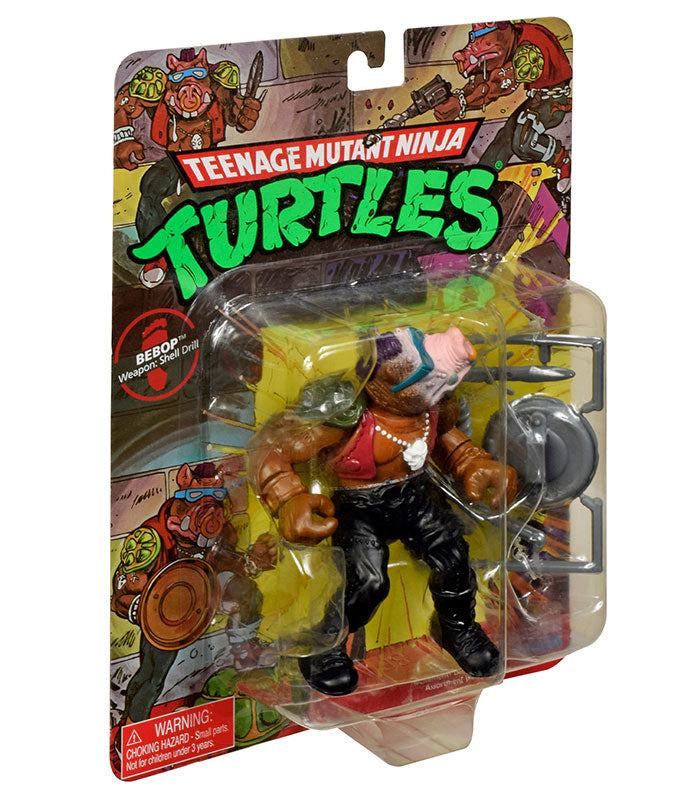 Teenage Mutant Ninja Turtles Classic Bebop action figure in packaging with weapons.