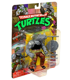 Teenage Mutant Ninja Turtles Classic Rocksteady action figure in packaging with weapons.