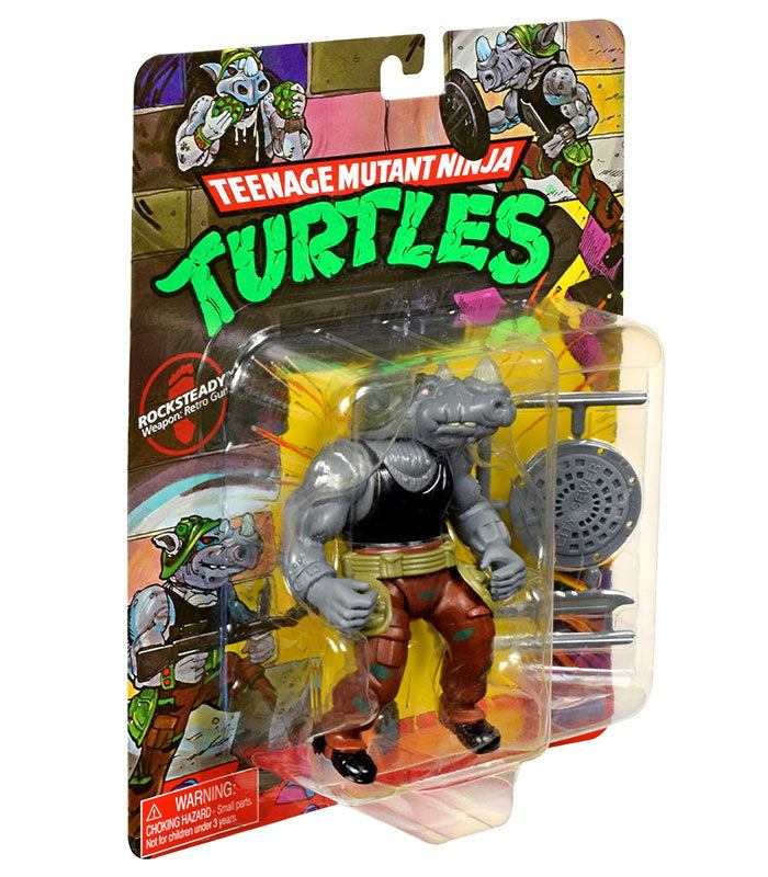 Teenage Mutant Ninja Turtles Classic Rocksteady action figure in packaging with weapons.