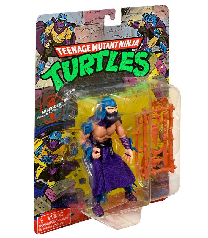 Teenage Mutant Ninja Turtles Classic Shredder action figure from 1988 with weapons and articulated joints in original packaging.