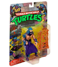 Teenage Mutant Ninja Turtles Classic Shredder action figure from 1988 with weapons and articulated joints in original packaging.