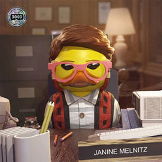 TUBBZ Ghostbusters Janine Melnitz Collectible Duck with red hair and glasses, on office desk.