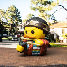 TUBBZ Stranger Things Lucas Sinclair Collectible Duck in iconic outfit with slingshot, outdoors.