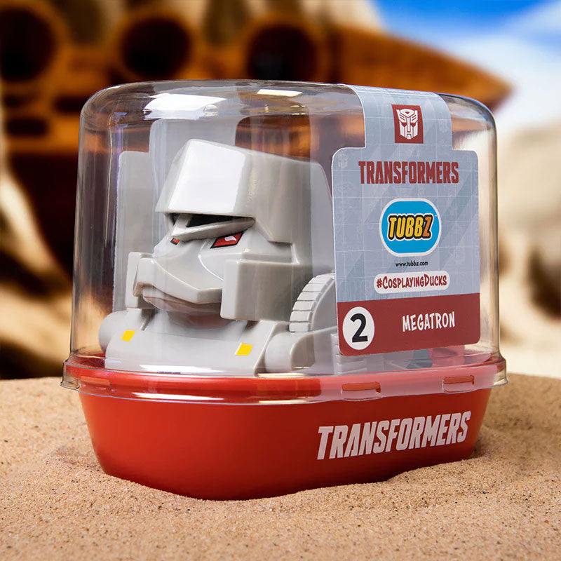 TUBBZ Transformers Megatron Collectible Duck in box, featuring Megatron's signature design and colors, on display.