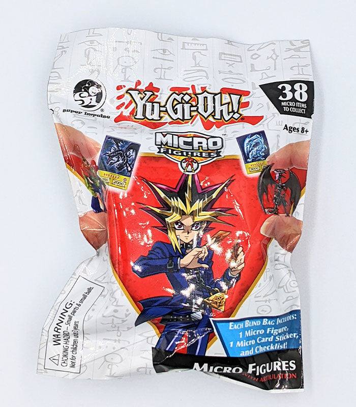 Yu-Gi-Oh! Micro Figures Blind Bag, collectible mini figures featuring iconic characters like Blue-Eyes White Dragon and Dark Magician.