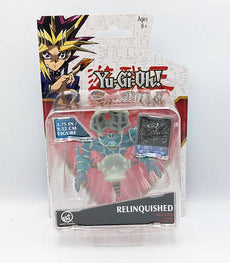Relinquished Yu-Gi-Oh! battle figure in packaging with exclusive card, 3.75-inch collectible toy.